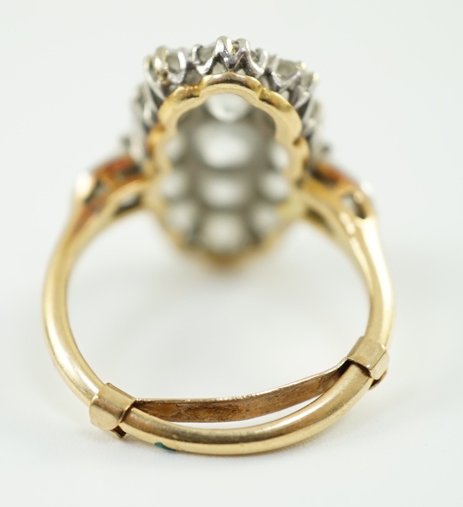 An 18ct gold and oval diamond cluster dress ring, with diamond set shoulders, set with seventeen - Image 4 of 5