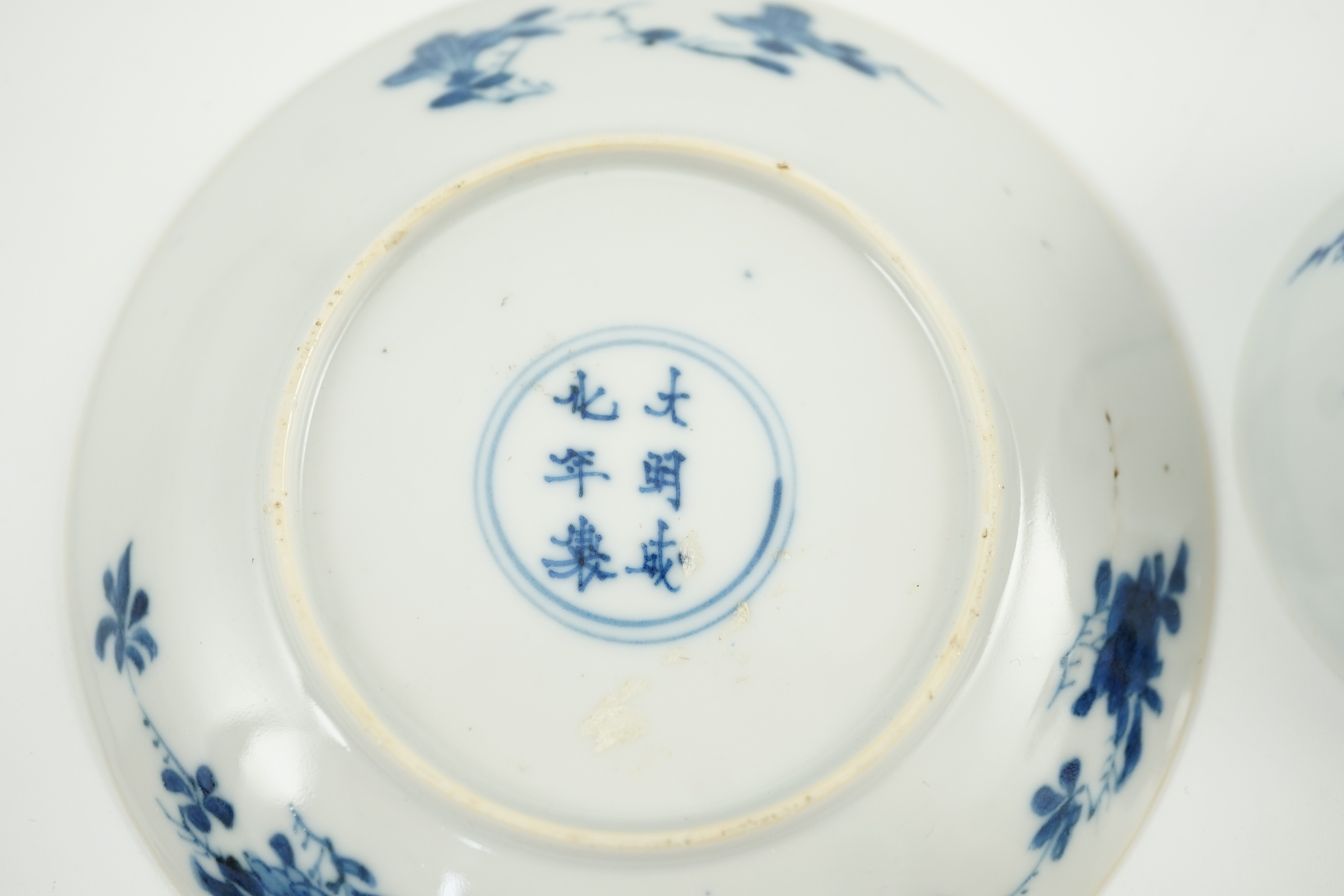 A Chinese blue and white tea bowl and saucer, Chenghua mark but Kangxi period, each painted with - Image 4 of 4