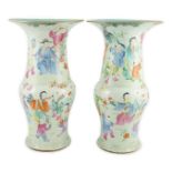 A pair of Chinese famille rose fencai ‘boys’ baluster vases, 19th century, each painted with boys