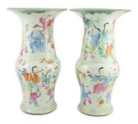 A pair of Chinese famille rose fencai ‘boys’ baluster vases, 19th century, each painted with boys