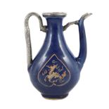 A Chinese late Ming blue glazed and slip decorated ‘qilin’ ewer, for the Islamic market, the