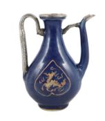 A Chinese late Ming blue glazed and slip decorated ‘qilin’ ewer, for the Islamic market, the