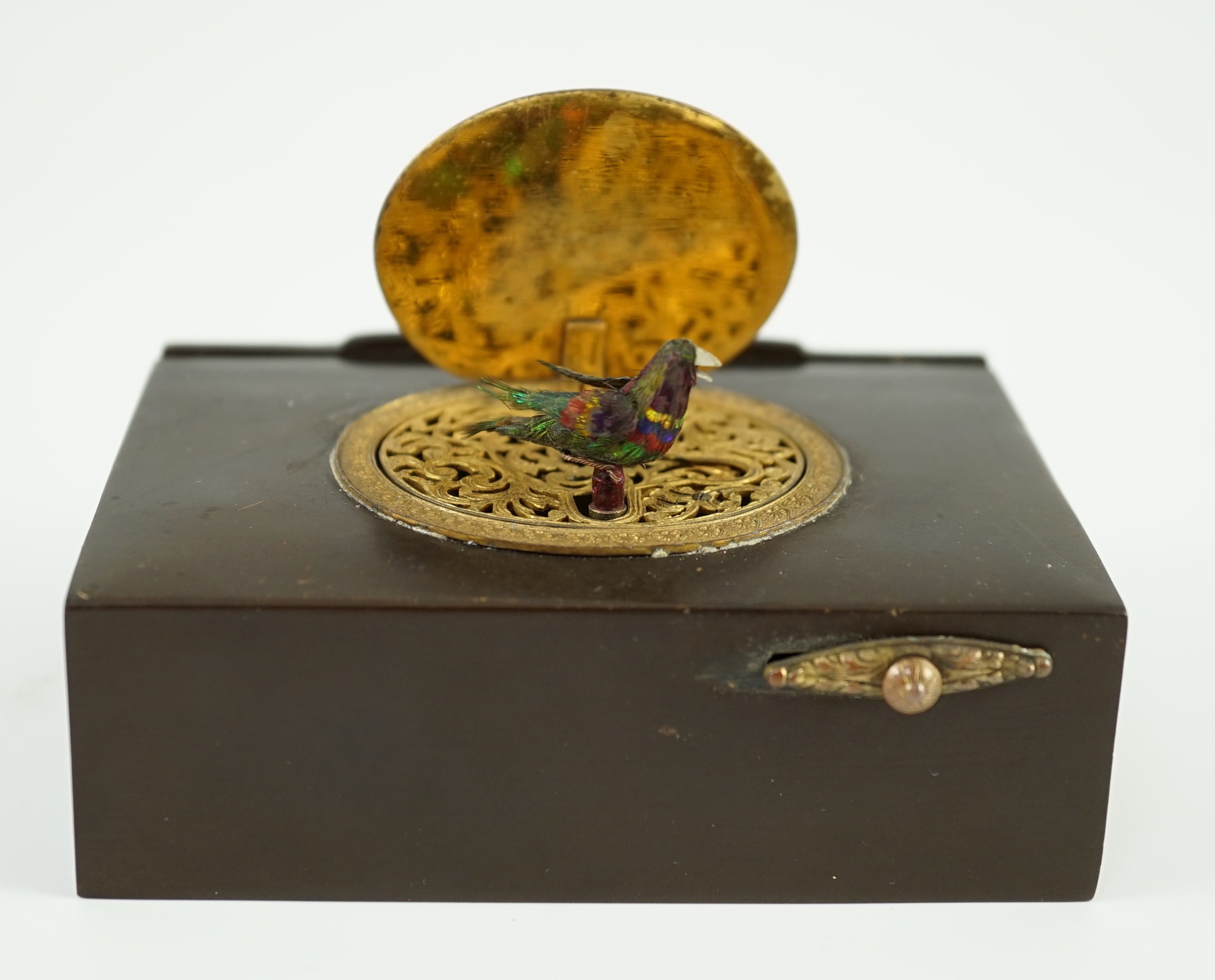 A late 19th century Swiss gilt metal mounted phenolic singing bird box, the lid decorated in - Image 6 of 6