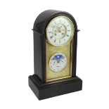 Henri Marc, Paris. A 19th century French arched top black marble mantel clock with perpetual