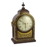 Davies & Napper. A Regency cut brass inlaid rosewood bracket clock, of arched architectural form,