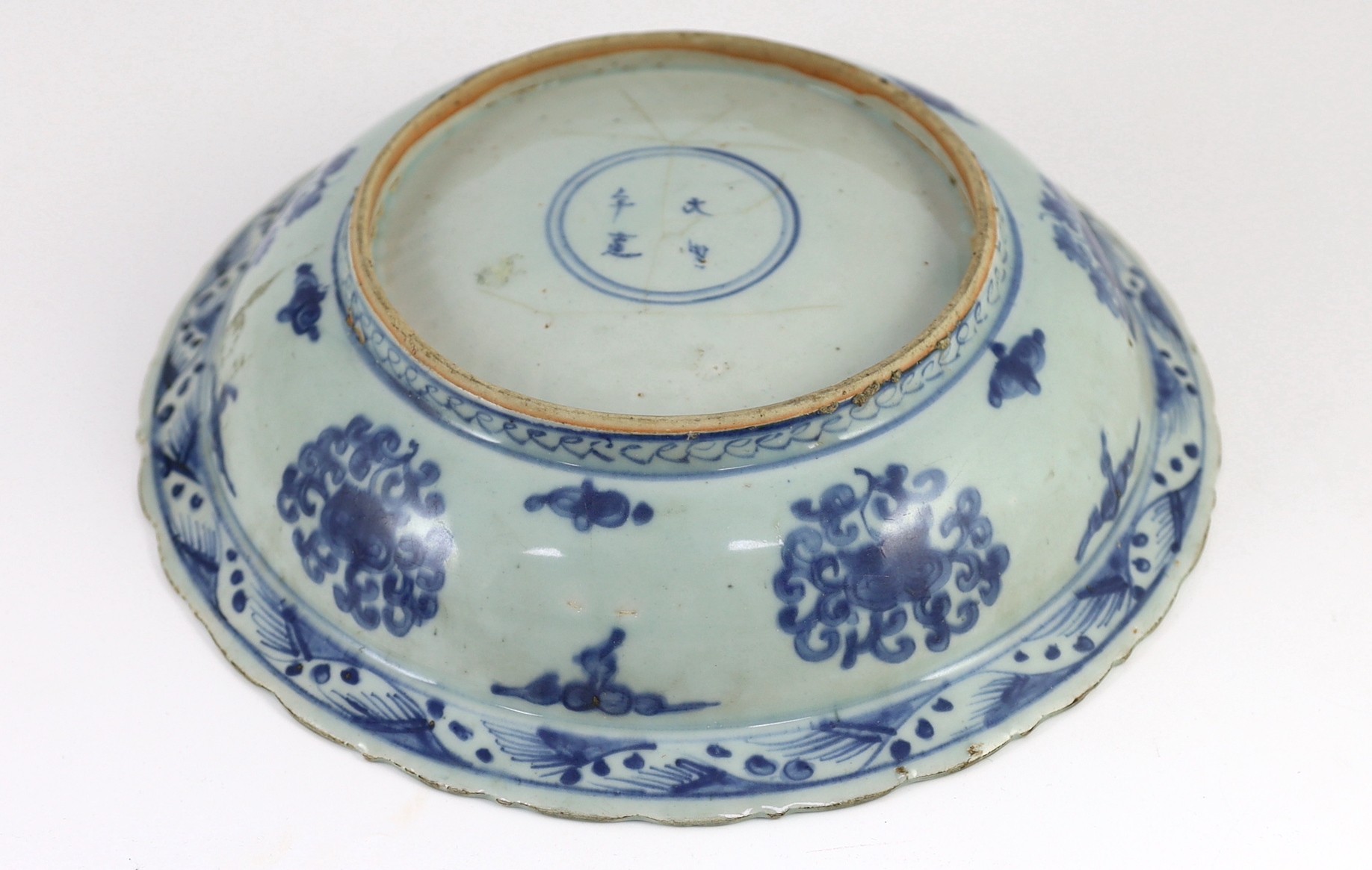 A Chinese Ming blue and white ‘lion’ dish, four character Ming mark, painted with four lions amid - Image 3 of 4