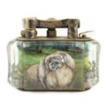 A rare Dunhill lucite cigarette lighter with unusual decoration of a Pekingese dog, silver plated