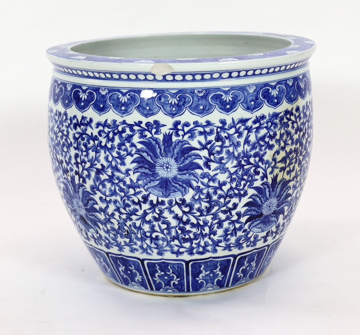 A Chinese blue and white ‘fish’ bowl, 20th century, painted with lotus flowers, scrolling tendrils - Image 4 of 5