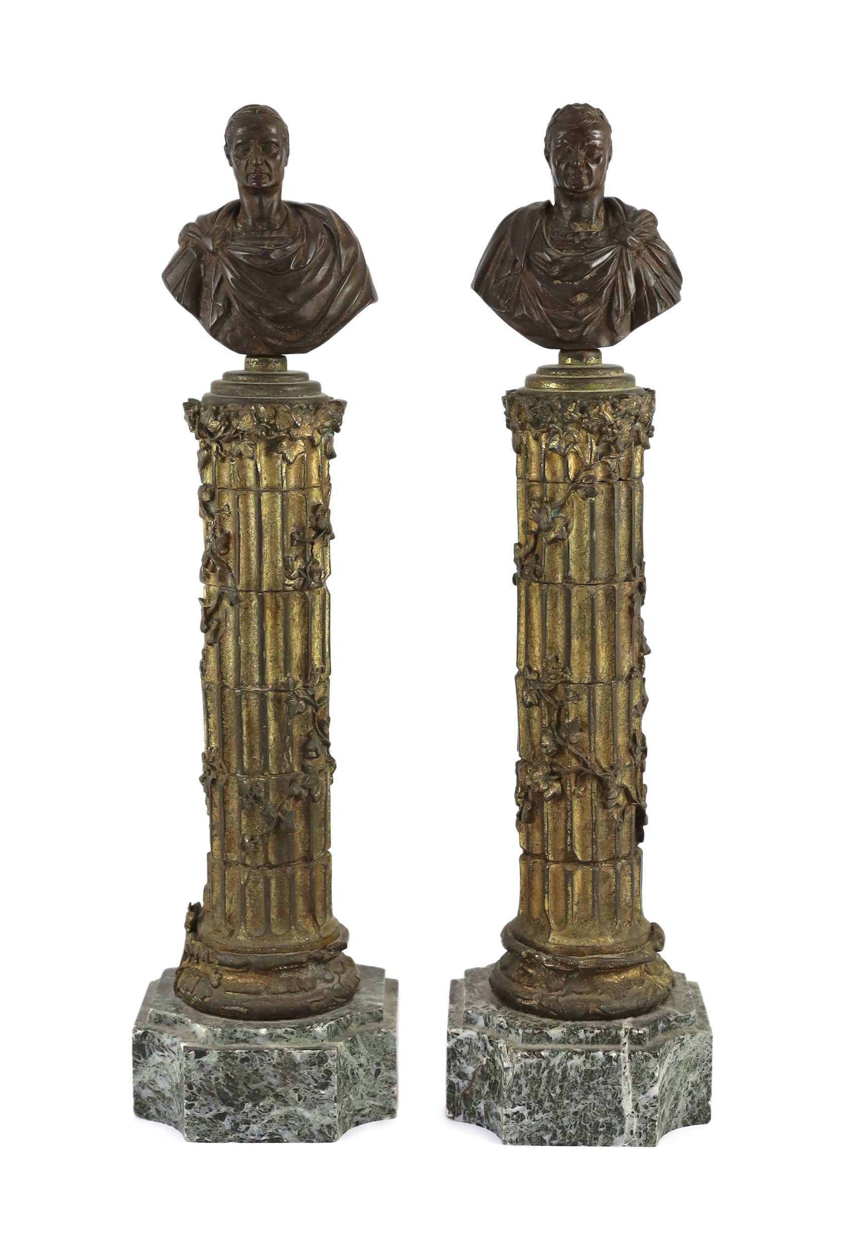 After the Antique. A pair of bronze busts of Roman Emperors, on gilt bronze ivy-entwined columns and