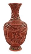 A Chinese cinnabar lacquer flattened baluster vase, 18th/19th century, carved in high relief with