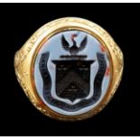 A Victorian 18ct gold and intaglio sardonyx set signet ring, the shank with engraved foliate