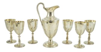 A modern cased silver ewer and six matching goblets by Courtman Silver Ltd, all with leaf