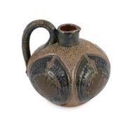 A Martin Brothers stoneware jug, c.1879, of squat ovoid form, decorated in brown and blue glazes