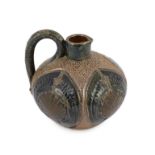 A Martin Brothers stoneware jug, c.1879, of squat ovoid form, decorated in brown and blue glazes