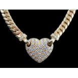 A modern 18ct gold and pave set diamond heart shaped pendant necklace, set with round brilliant