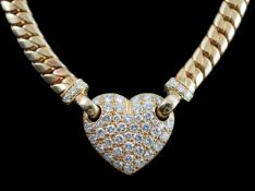 A modern 18ct gold and pave set diamond heart shaped pendant necklace, set with round brilliant