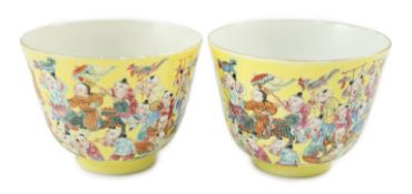 A pair of Chinese yellow ground 'Hundred Boys’ cups, 19th century, each a procession of boys, four