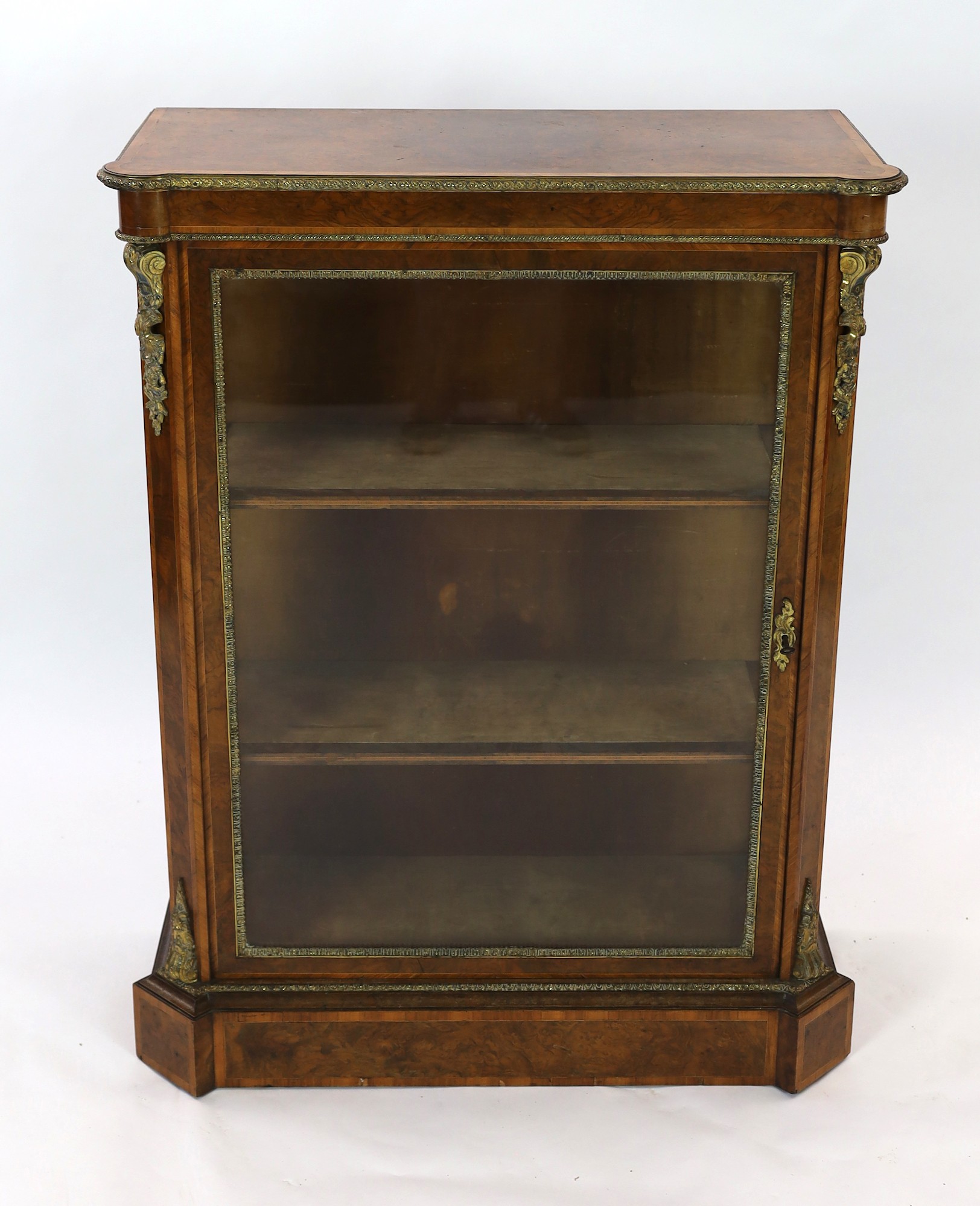 A 19th century French ormolu mounted figured walnut pier cabinet, with single glazed door and plinth - Image 2 of 4