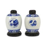 A pair of Chinese blue and white ribbed ovoid jars, Kangxi period, each painted with ‘Antiques’