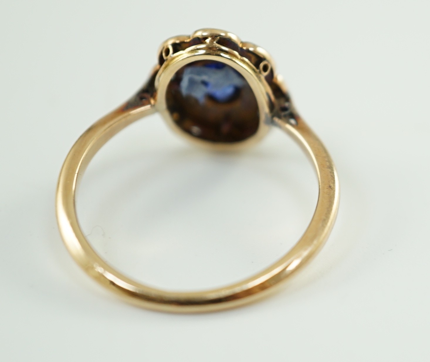 An early 20th century gold, sapphire and millegrain set rose cut diamond set oval cluster ring, size - Image 4 of 5
