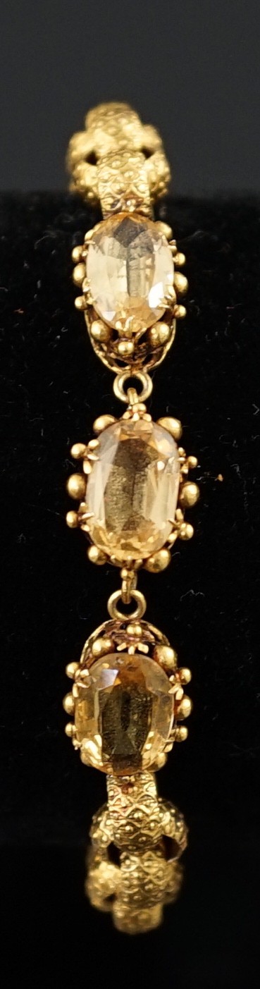 A 19th century cannetille work gold and four stone oval cut citrine set circular link bracelet, - Image 6 of 6