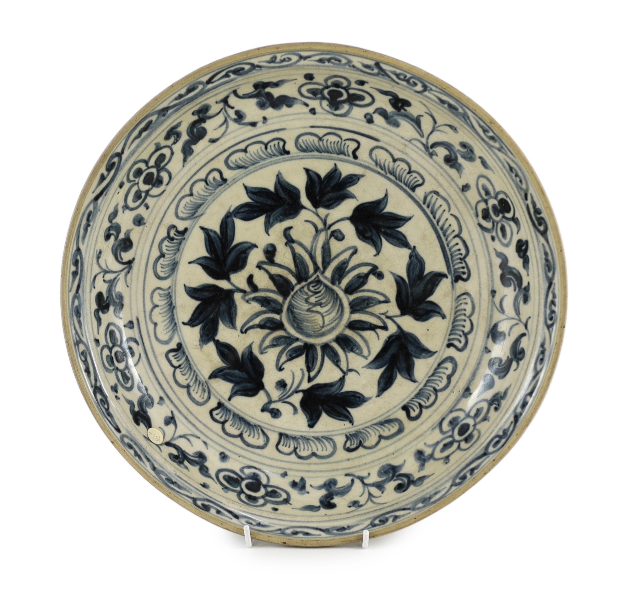 A large Annamese blue and white dish, 16th century, the centre painted with a flower and broad