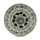 A large Annamese blue and white dish, 16th century, the centre painted with a flower and broad