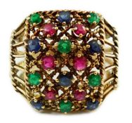 An Indian gold, ruby, sapphire and emerald cluster set dress ring, with rope twist shoulders, size
