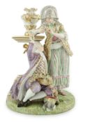 A Meissen porcelain group of a maid and a gallant by a pedestal, 19th century, underglaze blue