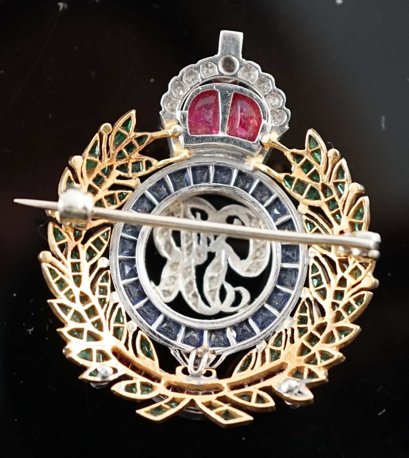 A gold and platinum, ruby, sapphire, emerald and diamond chip set Royal Engineers brooch, height - Image 2 of 2