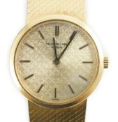 A lady's 18ct gold Patek Philippe manual wind wrist watch, on an integral 18ct gold Patek Philippe