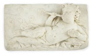 A 17th/18th century Italian marble plaque carved with a reclining cherub, Provenance - from Cyril