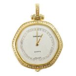 A modern 18ct gold and diamond set quartz shaped hexagonal pendant dress watch, retailed by Garrard,