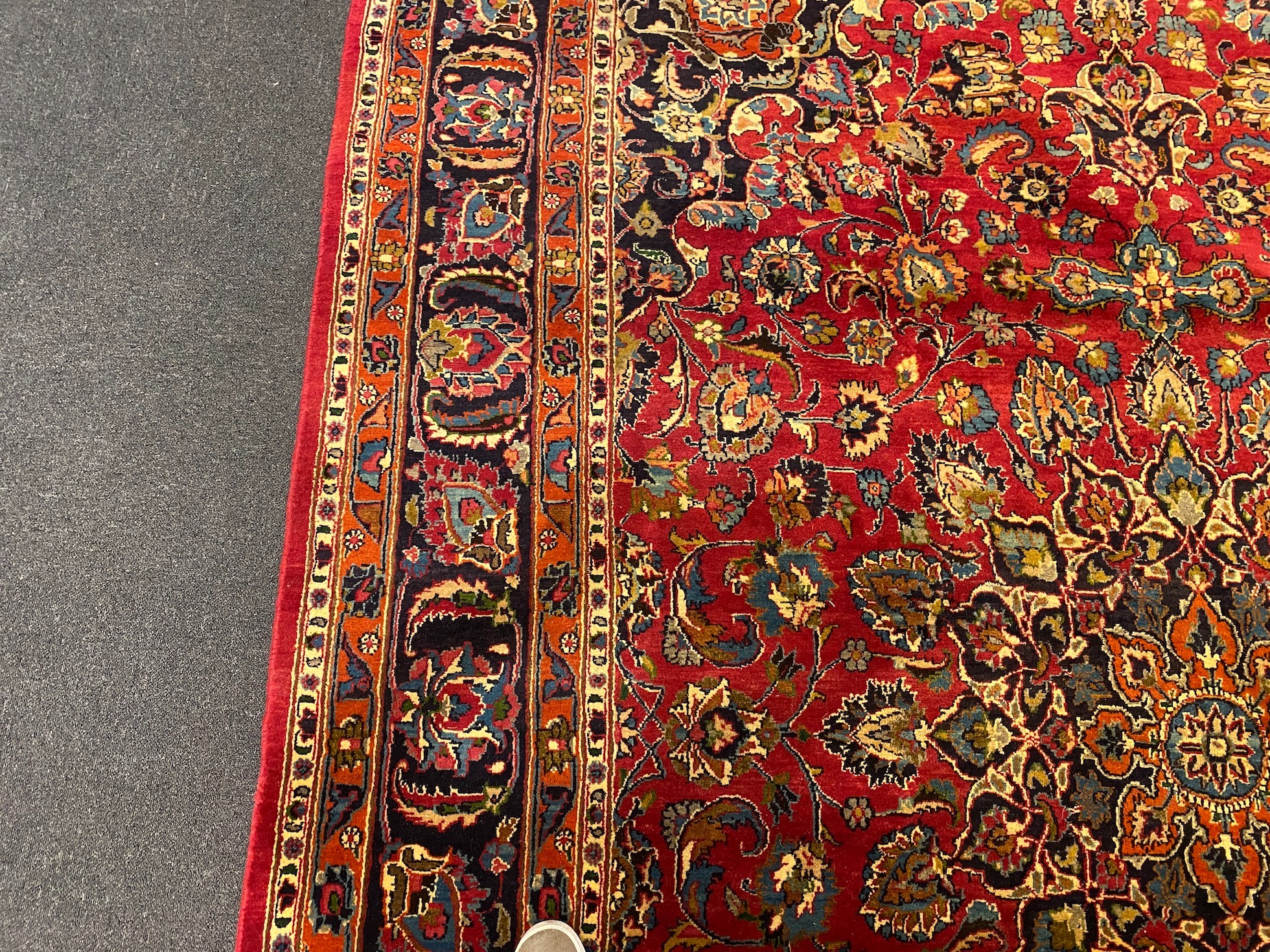 A Kashan claret ground carpet, woven with a central flowerhead medallion with palmettes and - Image 5 of 9