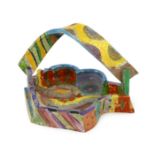 § § Angus Suttie (1946-1993), a multicoloured glazed stoneware dish or basket, with a twisted handle