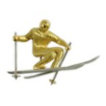 A gold and platinum novelty brooch modelled as a skier, length 39mm, 9.3 grams.***CONDITION