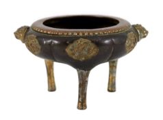 A Chinese Imperial copper alloy censer, ding, 18th century, the lobed dark brown patinated body with