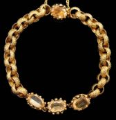 A 19th century cannetille work gold and four stone oval cut citrine set circular link bracelet,