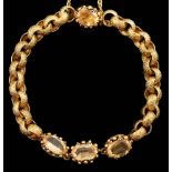 A 19th century cannetille work gold and four stone oval cut citrine set circular link bracelet,