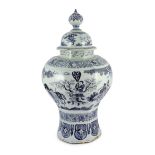 A massive Delft blue and white inverted baluster vase and cover, c.1700, painted with Chinese