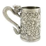 A late 19th century Chinese Export double skinned silver mug, by Cumwo, with dragon handle and