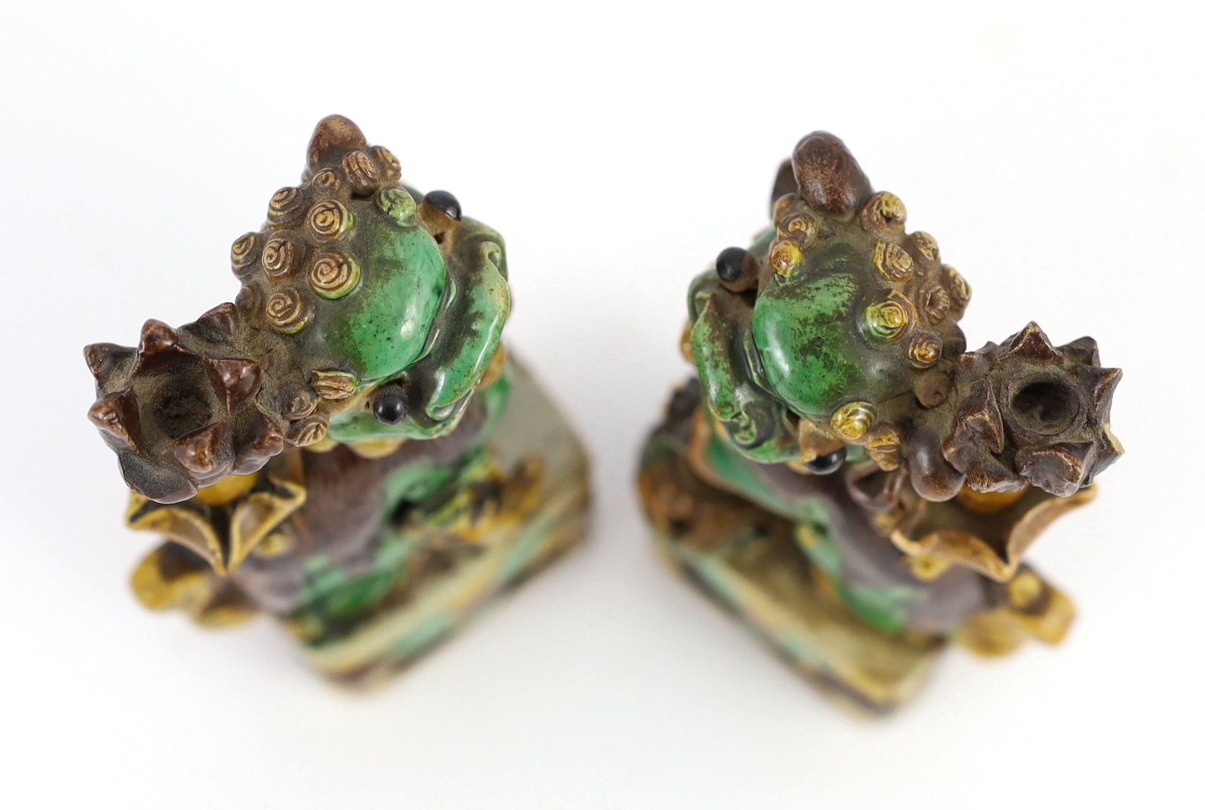 A pair of Chinese sancai-glazed biscuit Buddhist lion joss stick holders, Kangxi period, 15.5 and - Image 4 of 5