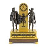 A 19th century French Louis XVI style bronze and ormolu mantel clock, surmounted with figures of