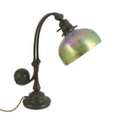 Tiffany Studios, a counter-balance patinated bronze desk lamp with ‘favrile’ glass shade, c.1905,