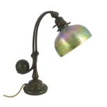 Tiffany Studios, a counter-balance patinated bronze desk lamp with ‘favrile’ glass shade, c.1905,