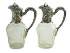 A pair of early 20th century French 950 standard silver mounted glass claret jugs, by Risler &