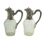 A pair of early 20th century French 950 standard silver mounted glass claret jugs, by Risler &
