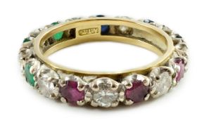 A modern 18ct gold, emerald, sapphire, ruby and diamond set full eternity ring, size O, gross weight