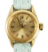 A lady's 18ct gold Rolex Oyster Perpetual wrist watch, on associated leather strap, with baton