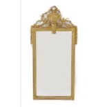 An early 19th century French gilt wood and gesso wall mirror, with ribbon, paterae and laurel leaf